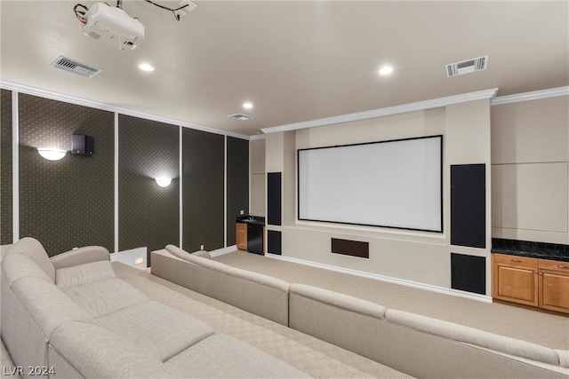 home theater featuring carpet floors and ornamental molding