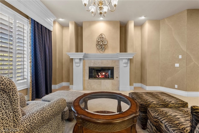 living room with a tiled fireplace and a notable chandelier