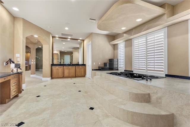 bathroom with vanity, a bathing tub, and tile patterned floors