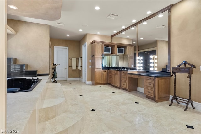 bathroom featuring tile patterned flooring and vanity