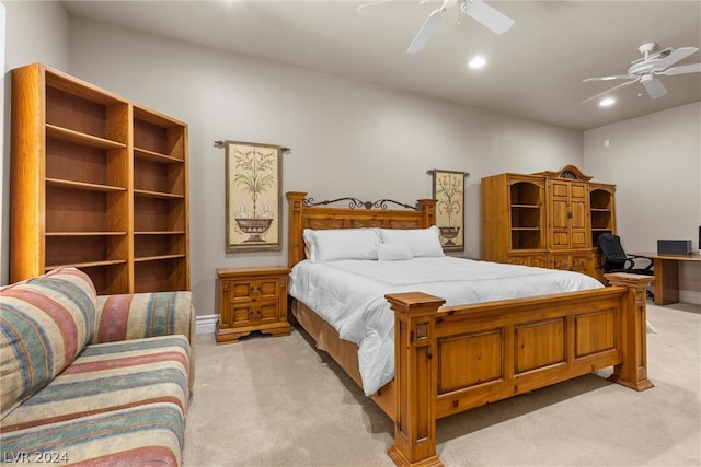 bedroom featuring light colored carpet and ceiling fan