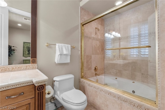 full bathroom with vanity, combined bath / shower with glass door, and toilet