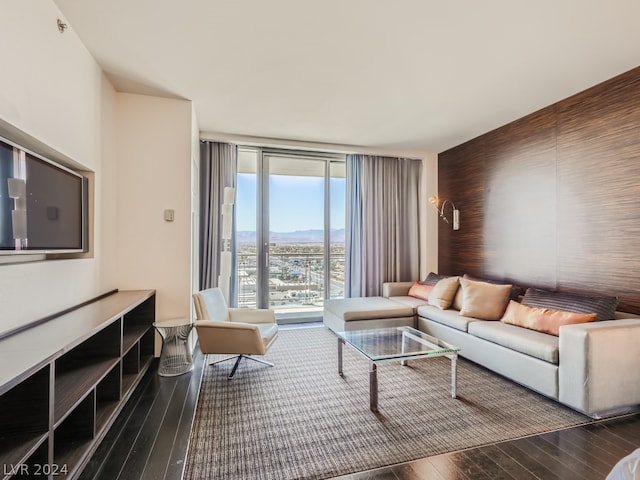 living room with hardwood / wood-style flooring and floor to ceiling windows