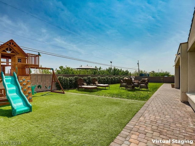 exterior space featuring a patio and a playground