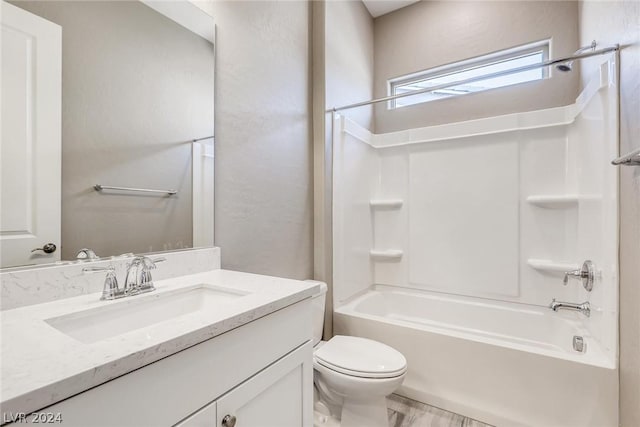 full bathroom featuring shower / tub combination, vanity, and toilet