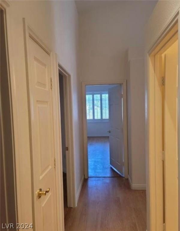 hall with dark hardwood / wood-style flooring