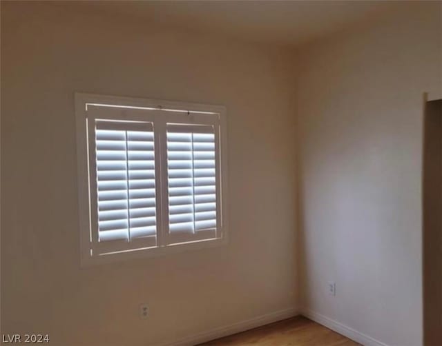 unfurnished room featuring light hardwood / wood-style flooring