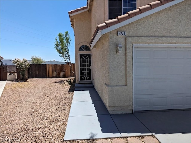 view of side of property with a garage