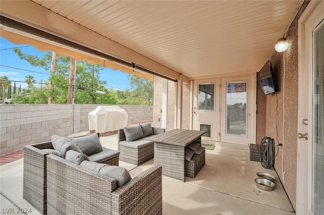 view of patio with area for grilling and an outdoor hangout area