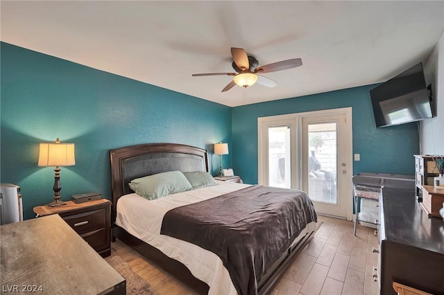 bedroom with ceiling fan and light hardwood / wood-style flooring