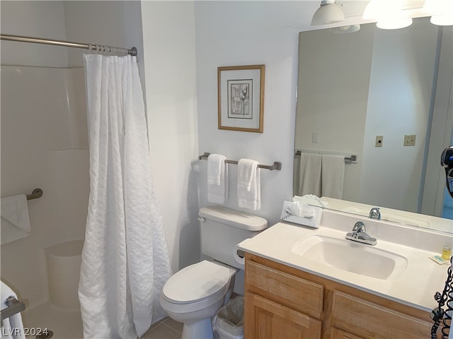 bathroom featuring toilet, tile patterned flooring, vanity, and a shower with shower curtain