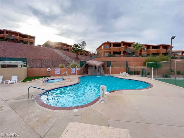 view of swimming pool with a patio