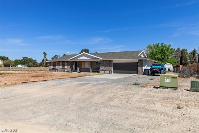 ranch-style house featuring a garage