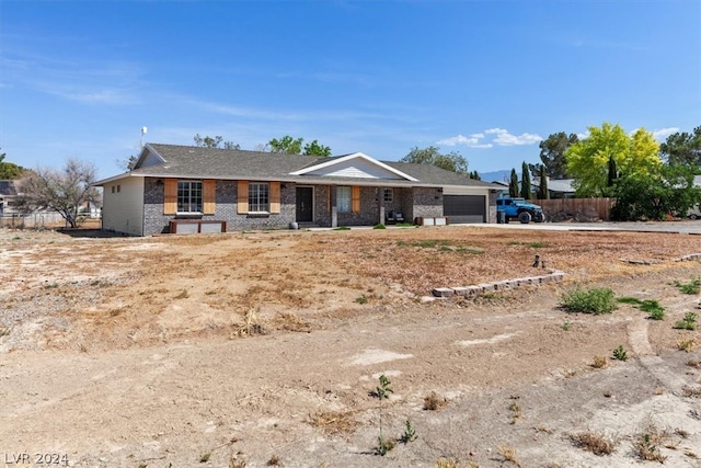 back of property featuring a garage