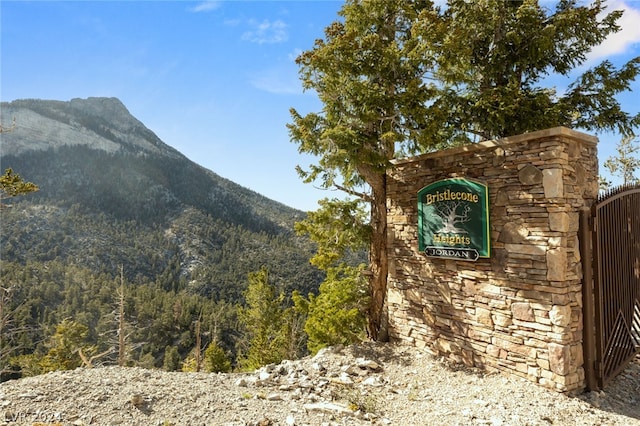 community sign featuring a mountain view