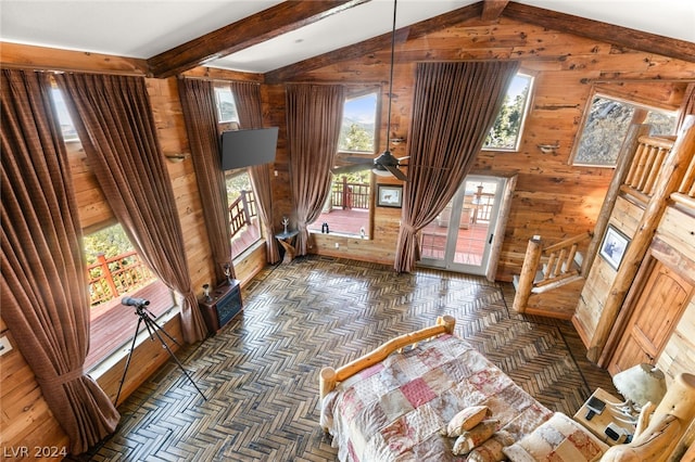 living room featuring ceiling fan, vaulted ceiling with beams, wood walls, and parquet flooring