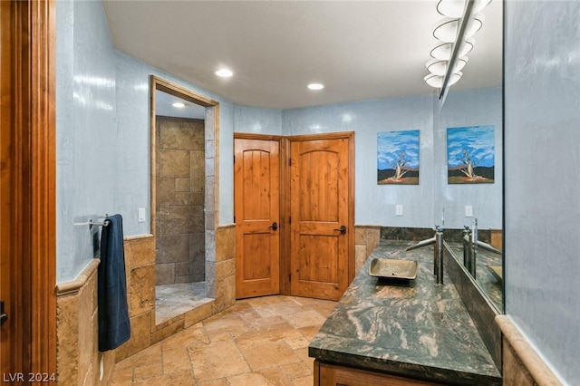 4910 Cougar Ridge Trl, Mount Charleston, NV 89124 - bathroom with stone tile flooring, vanity, a shower stall, and recessed lighting
