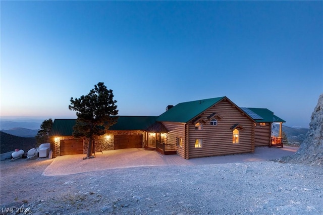 4910 Cougar Ridge Trl, Mount Charleston, NV 89124 - log cabin with dirt driveway and metal roof