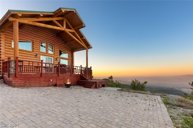 view of patio terrace at dusk