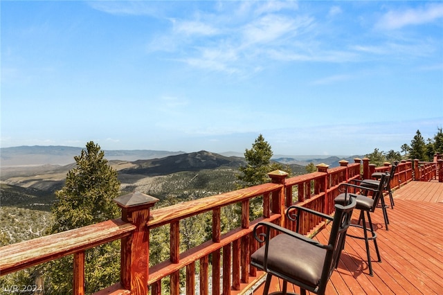 wooden terrace featuring a mountain view