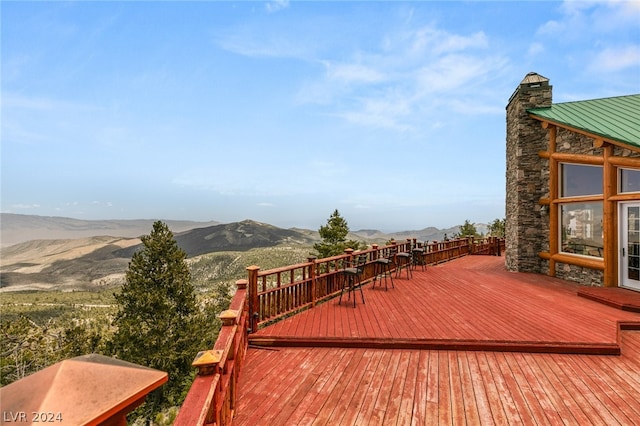 wooden terrace featuring a mountain view