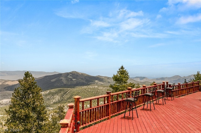 wooden deck featuring a mountain view