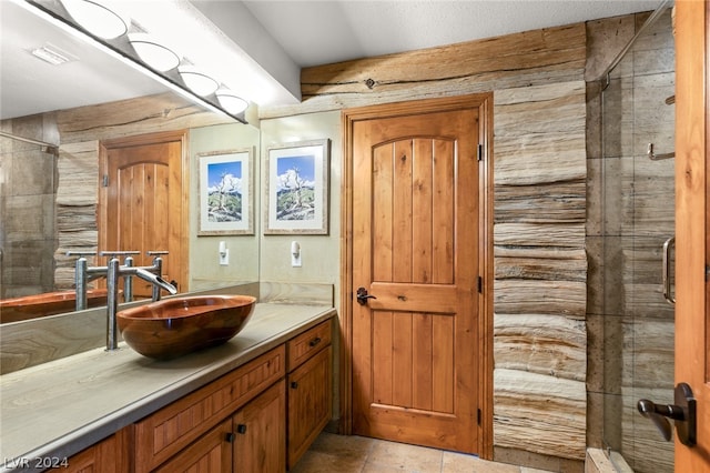 bathroom with tile floors, an enclosed shower, and oversized vanity