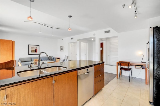 29 Montelago Blvd Unit 201, Henderson, NV 89011 - kitchen with pendant lighting, light tile patterned flooring, sink, and appliances with stainless steel finishes