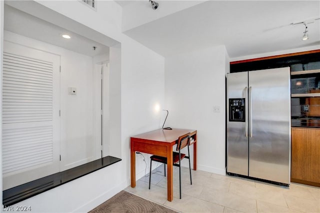 29 Montelago Blvd Unit 201, Henderson, NV 89011 - kitchen with stainless steel fridge with ice dispenser, light tile patterned floors, and track lighting