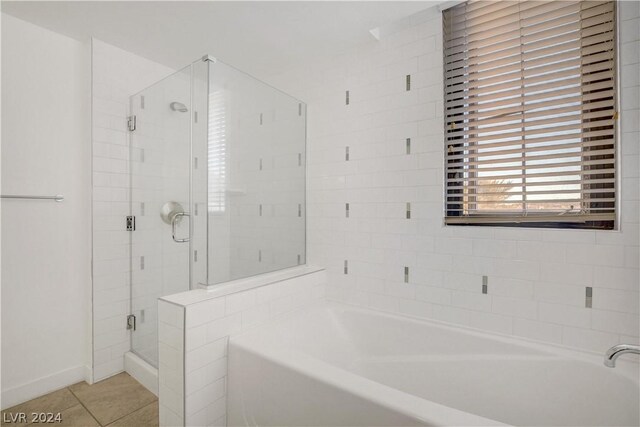 29 Montelago Blvd Unit 201, Henderson, NV 89011 - bathroom featuring tile patterned floors and separate shower and tub