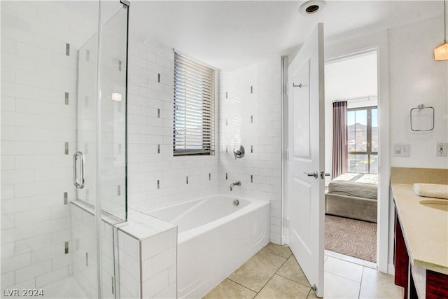 29 Montelago Blvd Unit 201, Henderson, NV 89011 - bathroom featuring tile patterned floors, separate shower and tub, and vanity