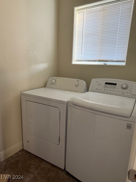 clothes washing area featuring independent washer and dryer