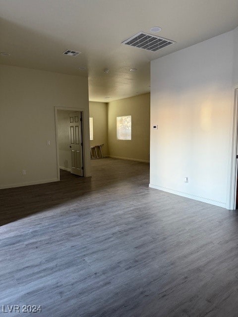 spare room featuring dark hardwood / wood-style floors