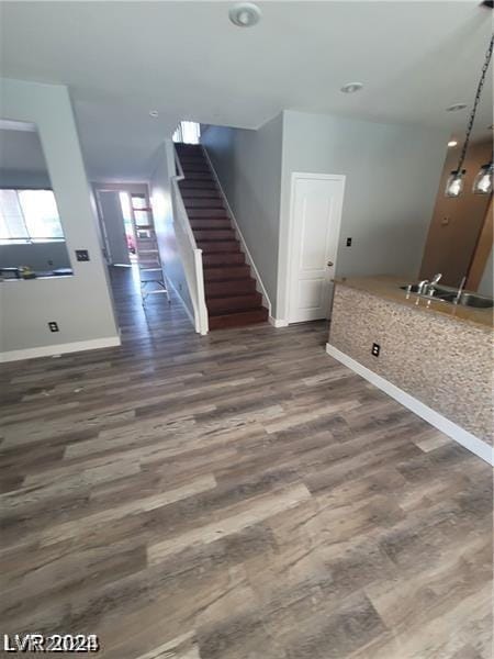 interior space with dark hardwood / wood-style floors and sink