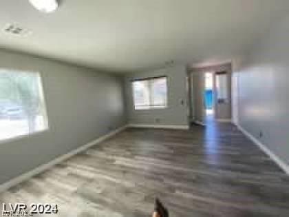 empty room featuring dark wood-type flooring