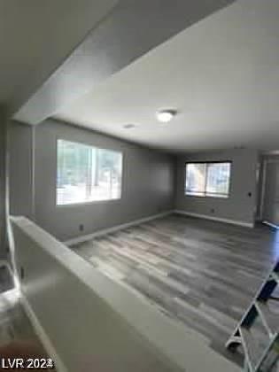 bonus room with hardwood / wood-style floors