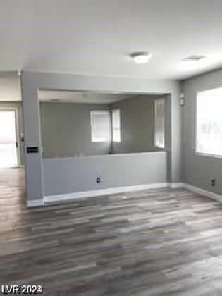 spare room with dark hardwood / wood-style flooring