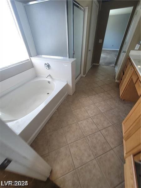 bathroom featuring a bathing tub and tile patterned floors