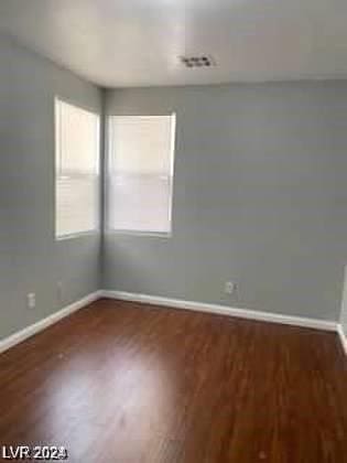 empty room featuring dark wood-type flooring