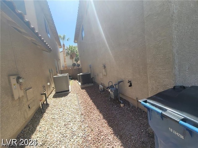 view of property exterior with central AC unit