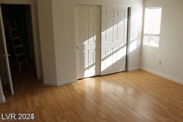 spare room featuring light wood-type flooring