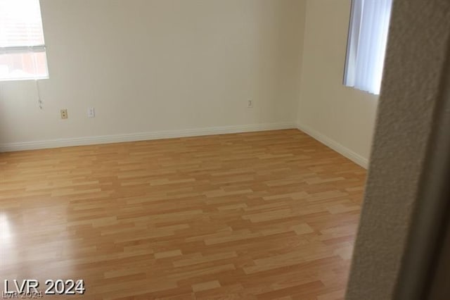 unfurnished room featuring light hardwood / wood-style flooring