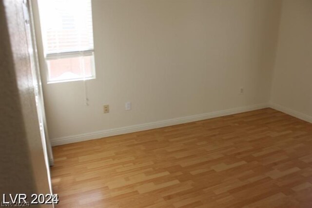 unfurnished room featuring light hardwood / wood-style floors