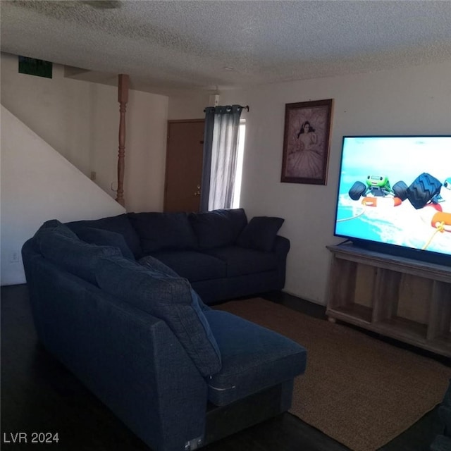 living room with a textured ceiling