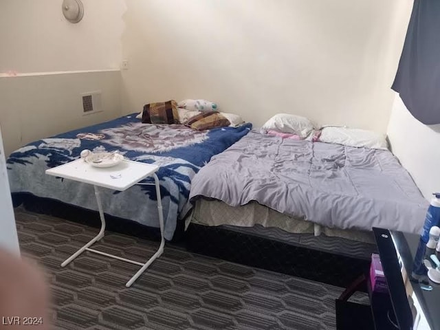 carpeted bedroom with visible vents