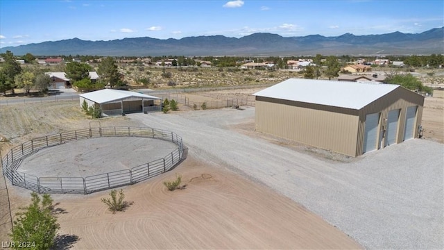 birds eye view of property featuring a mountain view