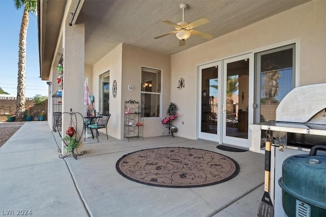 view of patio with french doors and ceiling fan