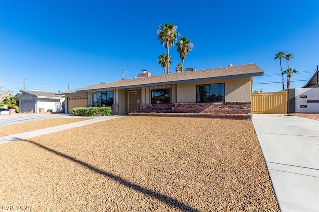 single story home with a garage