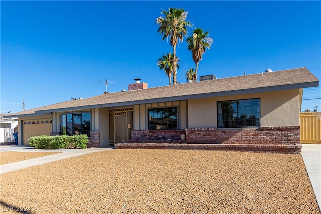 single story home featuring a garage