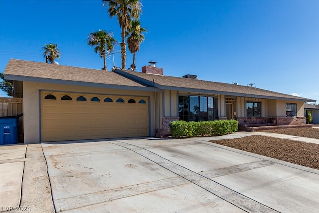 single story home featuring a garage